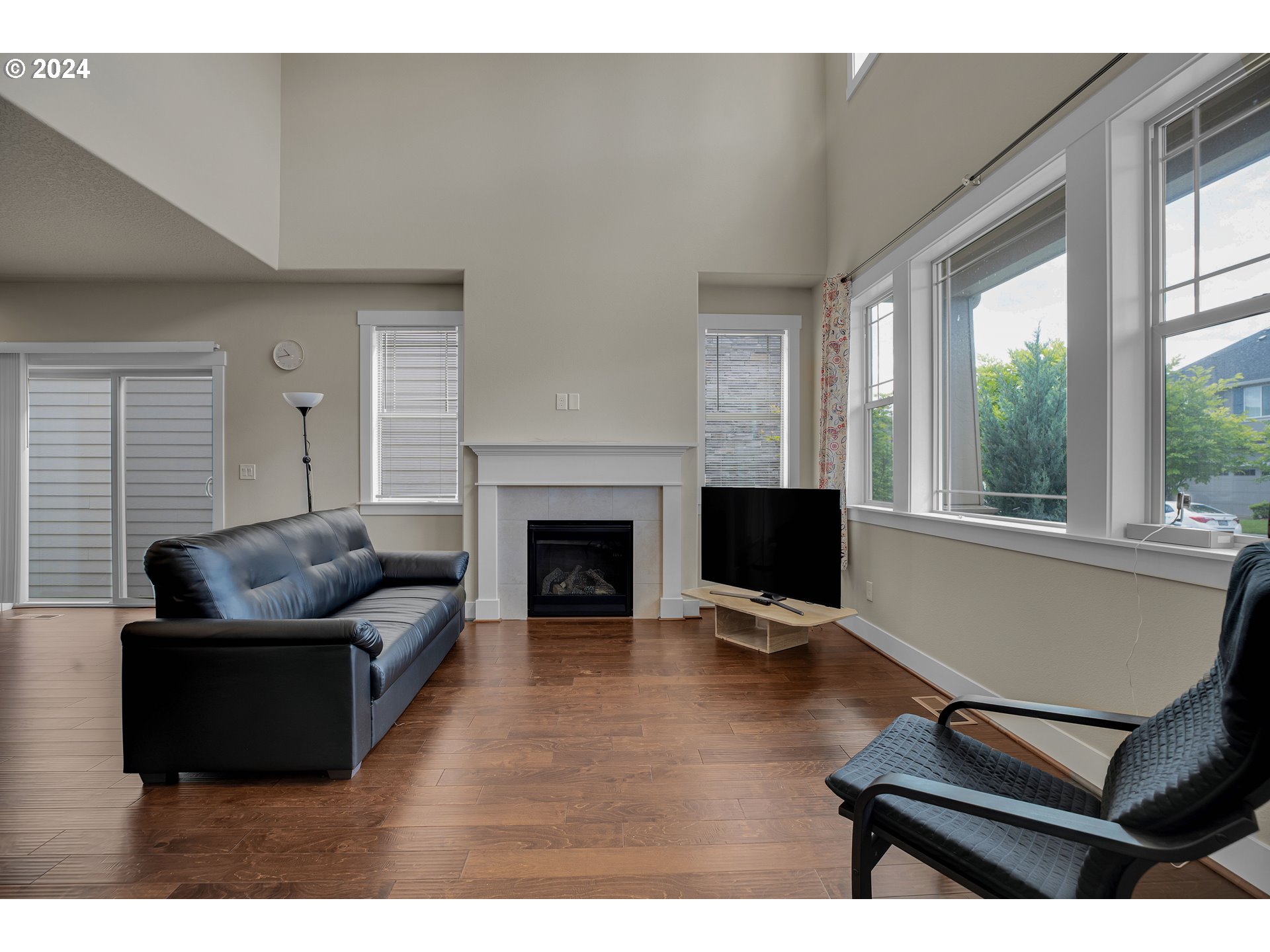 16937 Southwest Friendly Lane Beaverton, OR 97007 - Photo 4 of 44 a living room with furniture and a fireplace
