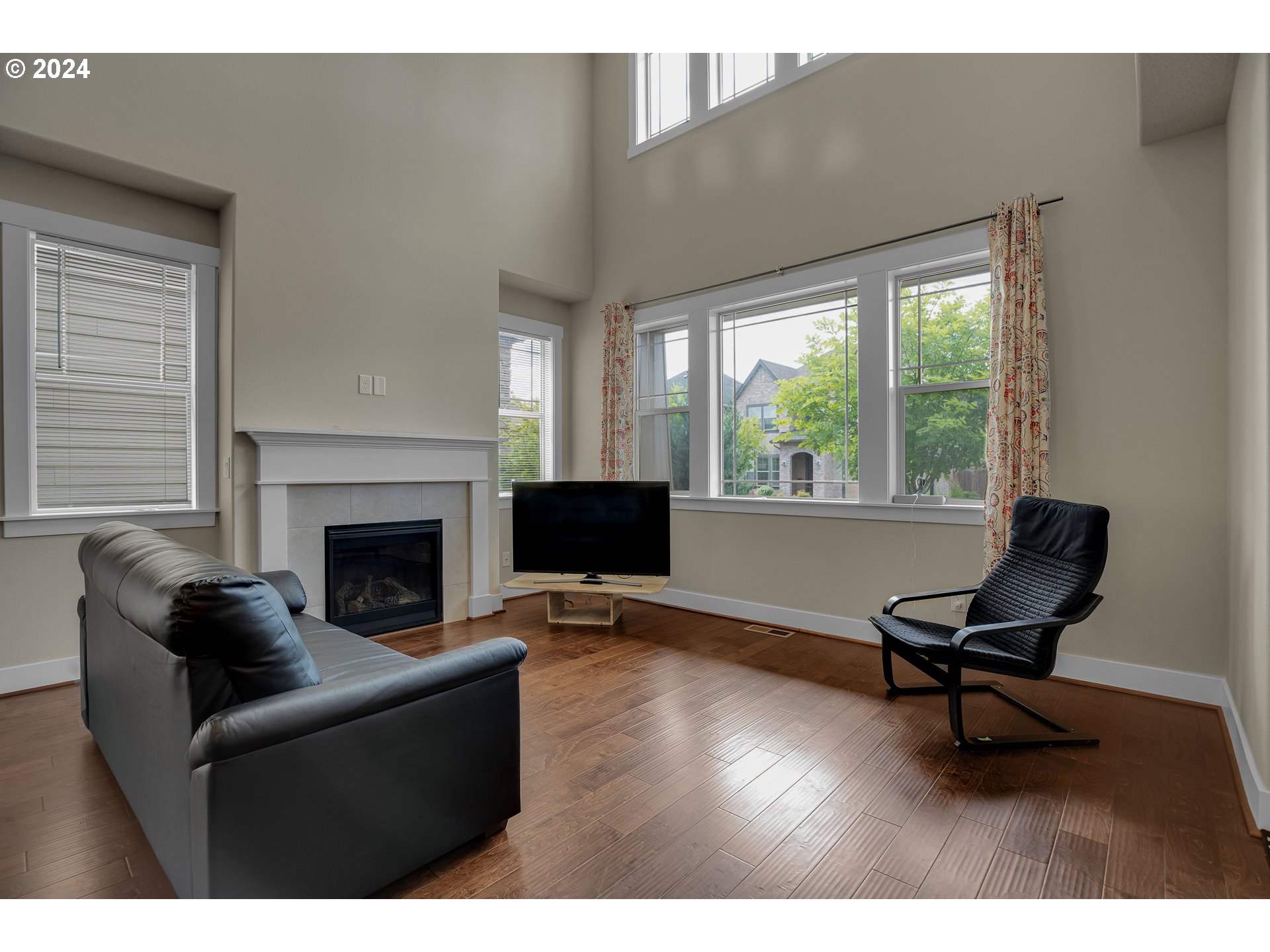 16937 Southwest Friendly Lane Beaverton, OR 97007 - Photo 5 of 44 a living room with furniture and a fireplace