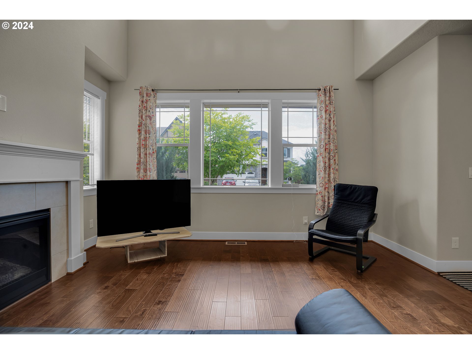 16937 Southwest Friendly Lane Beaverton, OR 97007 - Photo 6 of 44 a living room with furniture and a flat screen tv