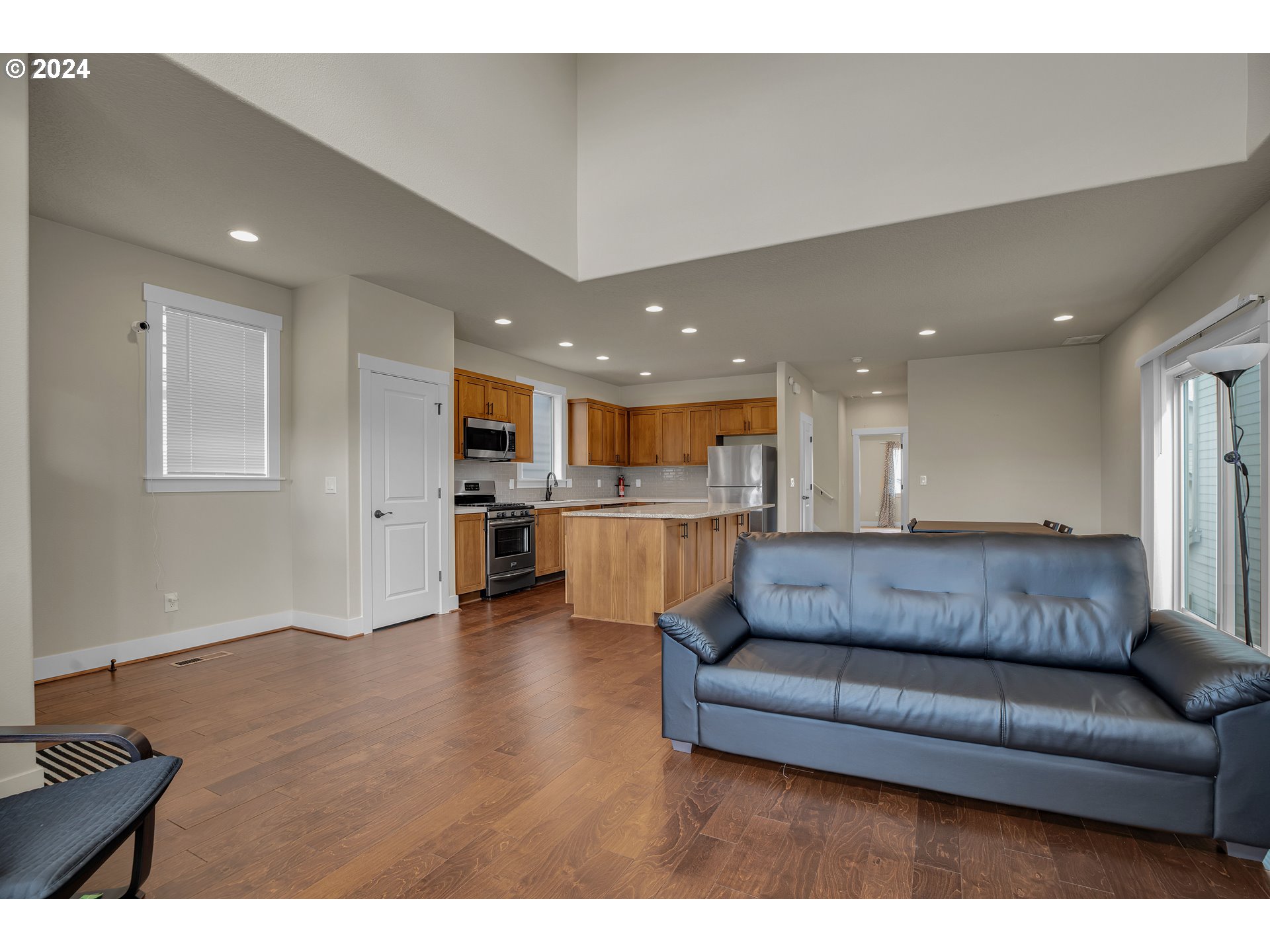 16937 Southwest Friendly Lane Beaverton, OR 97007 - Photo 7 of 44 a living room with furniture and kitchen view