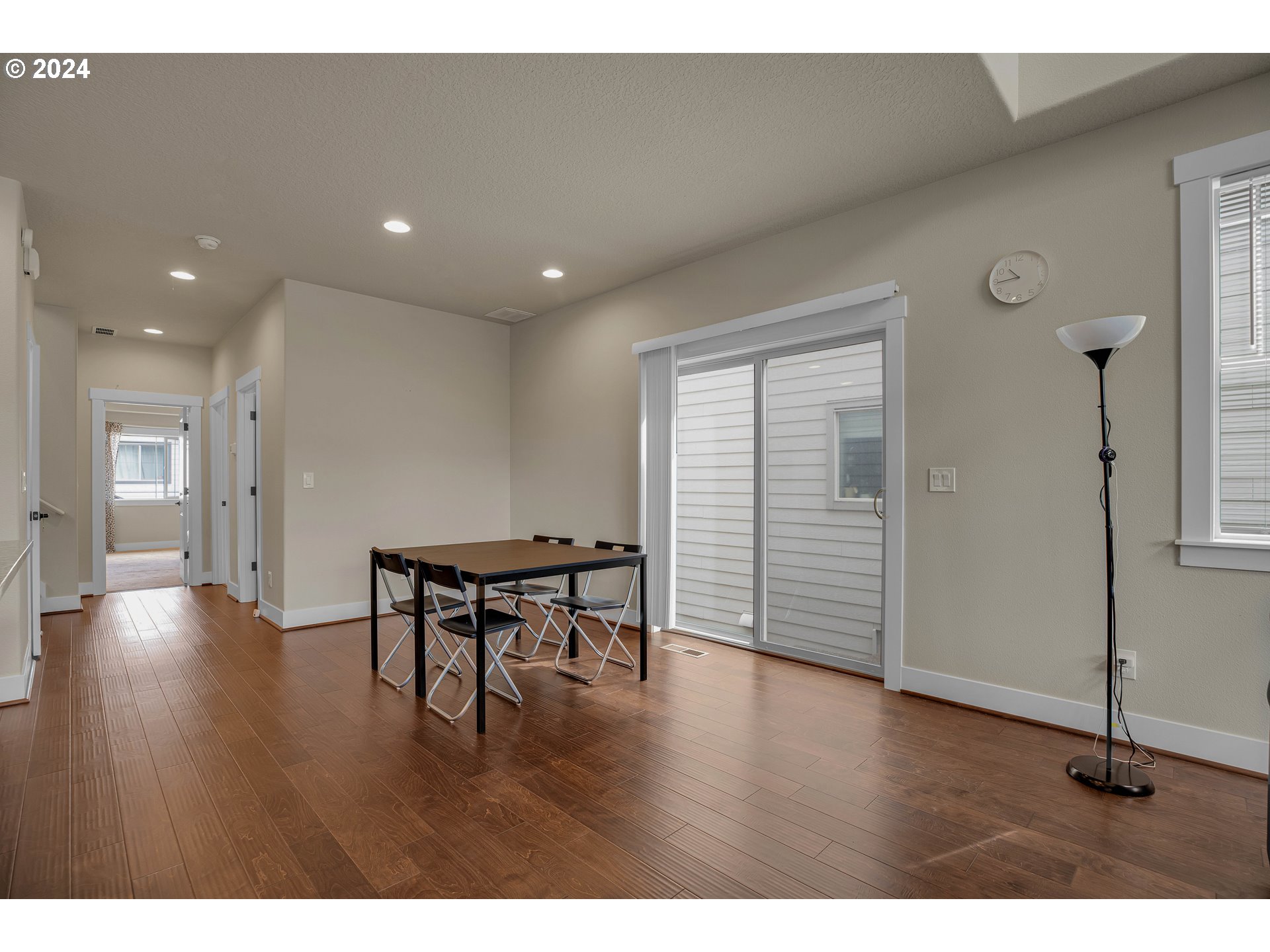 16937 Southwest Friendly Lane Beaverton, OR 97007 - Photo 8 of 44 a view of empty room with wooden floor