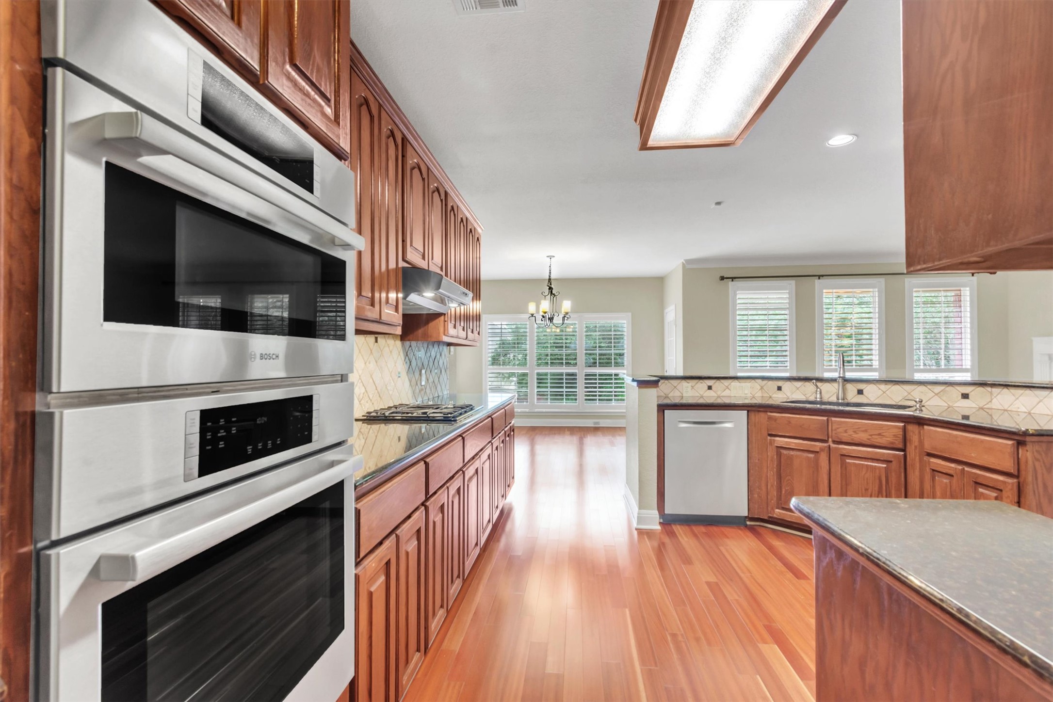 6008 Tributary Ridge Court Austin, TX 78759 - Photo 10 of 36 Culinary aspirations find a home in this well-appointed kitchen abundant cabinetry.