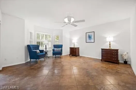 a living room with furniture and a lamp