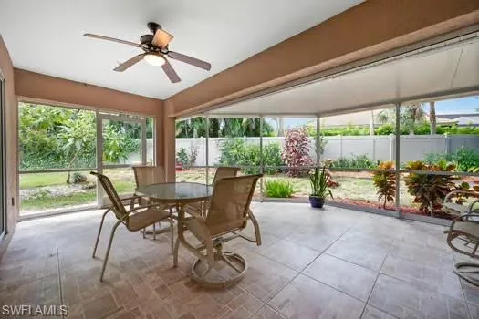 a view of a dining room with furniture water view and garden view