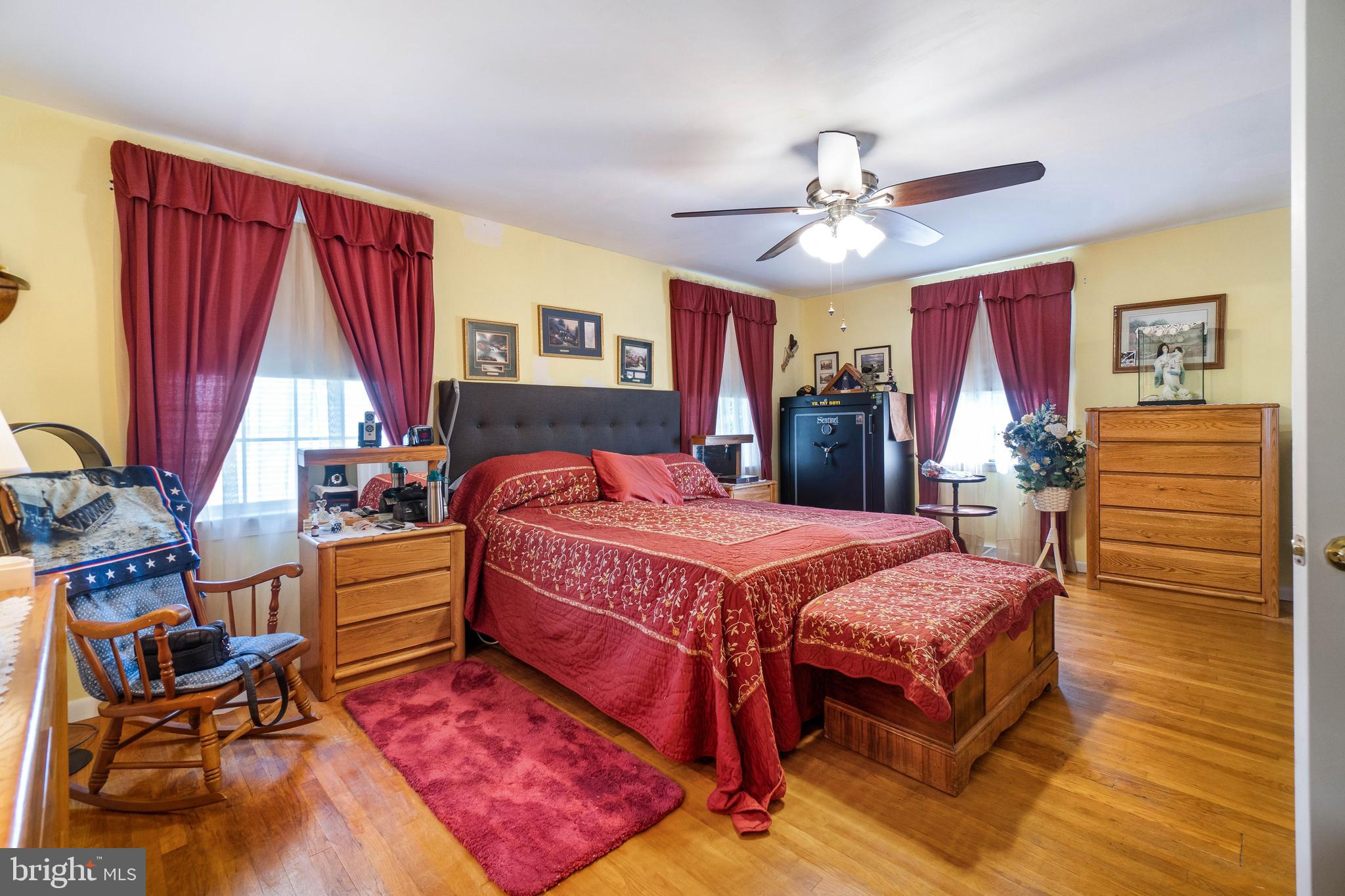 22 Peach Road Elkton, MD 21921 - Photo 14 of 24 a bedroom with a bed and wooden floor