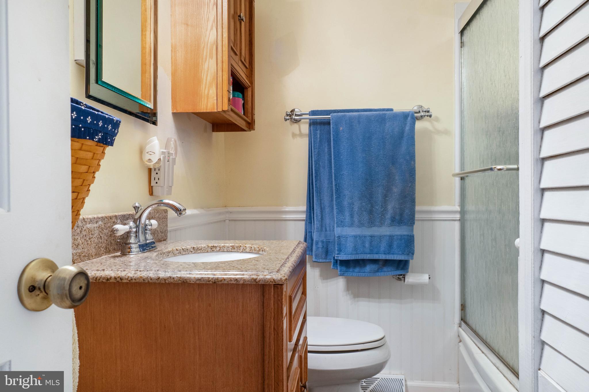 22 Peach Road Elkton, MD 21921 - Photo 17 of 24 a bathroom with a granite countertop sink a toilet and a mirror