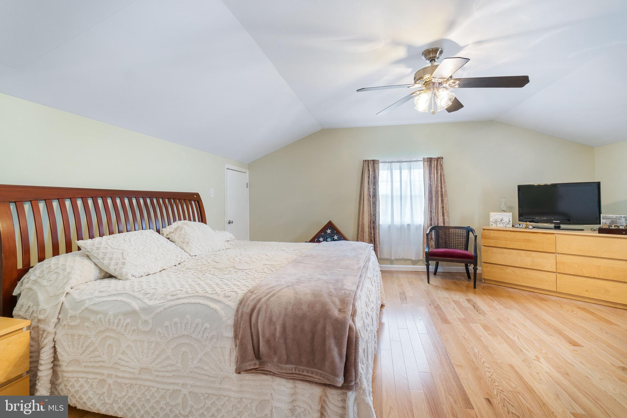 22 Peach Road Elkton, MD 21921 - Photo 18 of 24 a bedroom with a bed and a chandelier