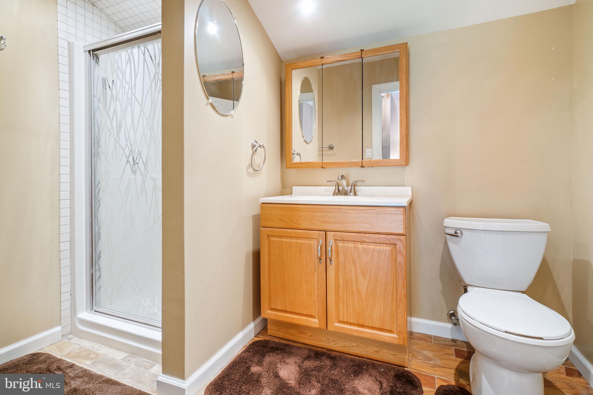 22 Peach Road Elkton, MD 21921 - Photo 21 of 24 a bathroom with a toilet sink and mirror