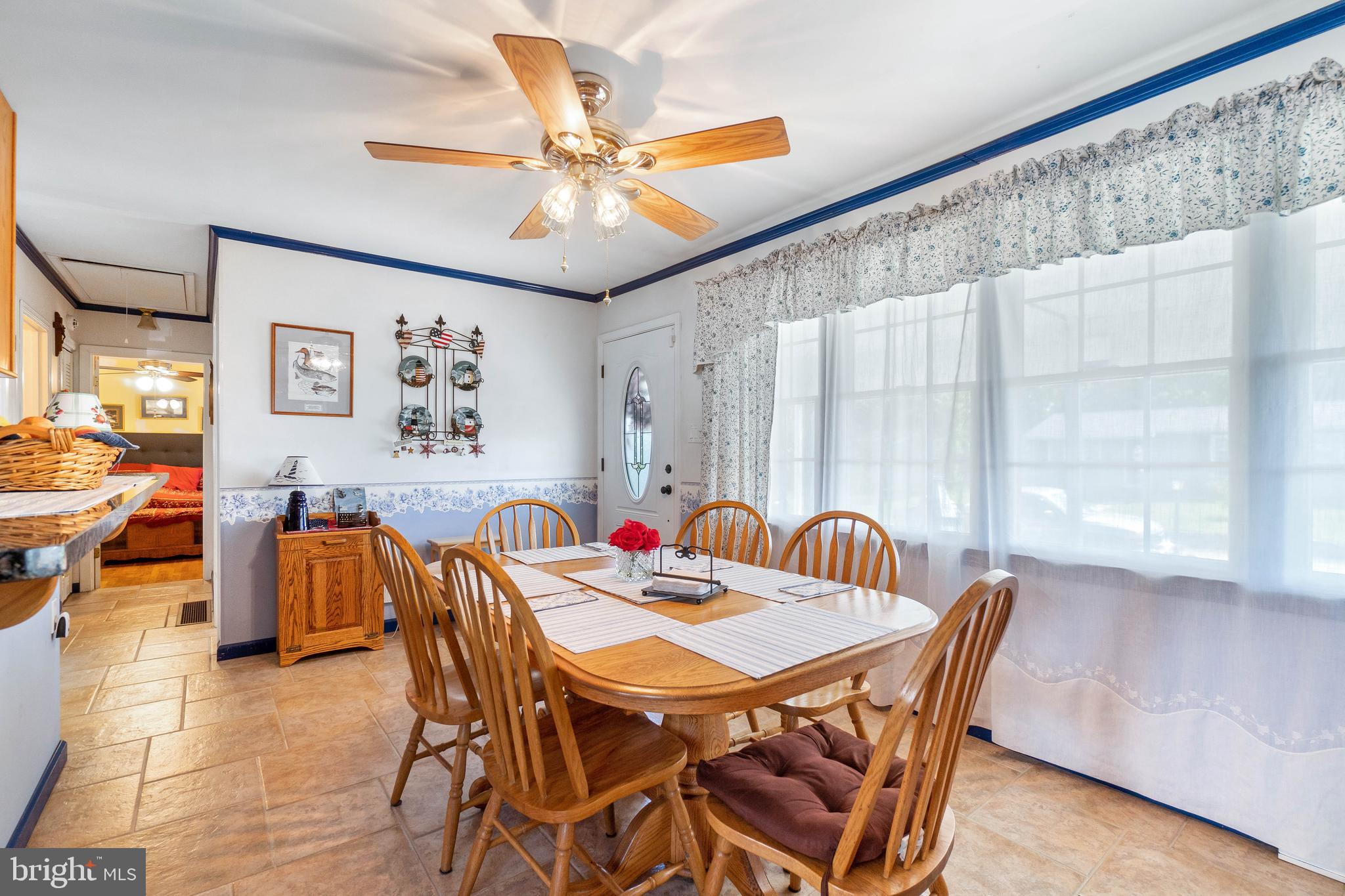 22 Peach Road Elkton, MD 21921 - Photo 8 of 24 a view of a dining room with furniture and a large window