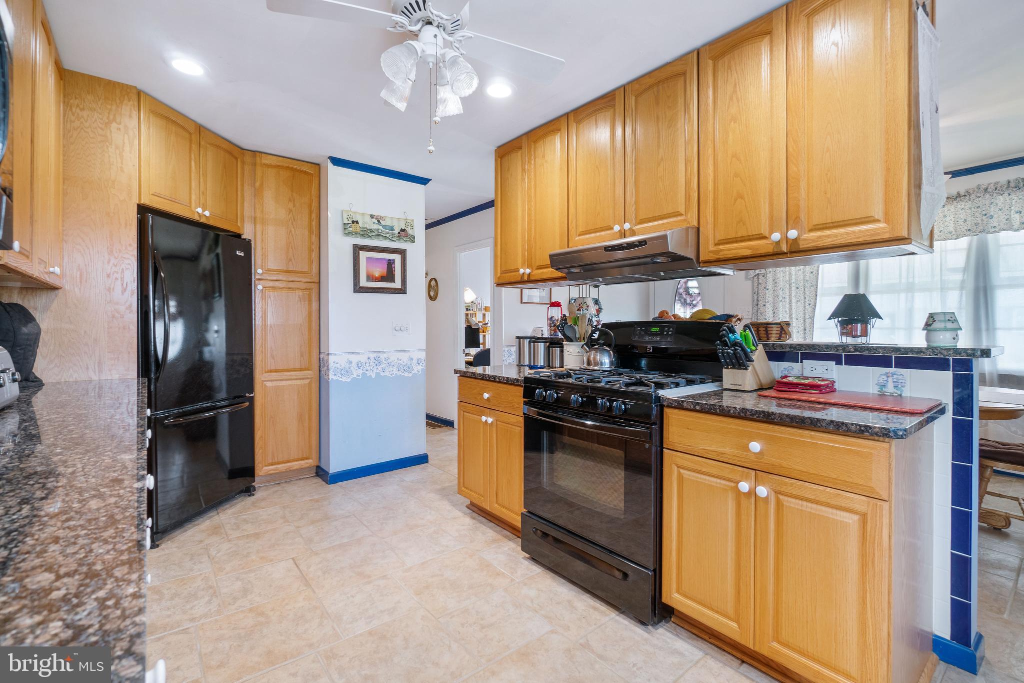 22 Peach Road Elkton, MD 21921 - Photo 10 of 24 a kitchen with stainless steel appliances granite countertop a refrigerator a stove and a sink