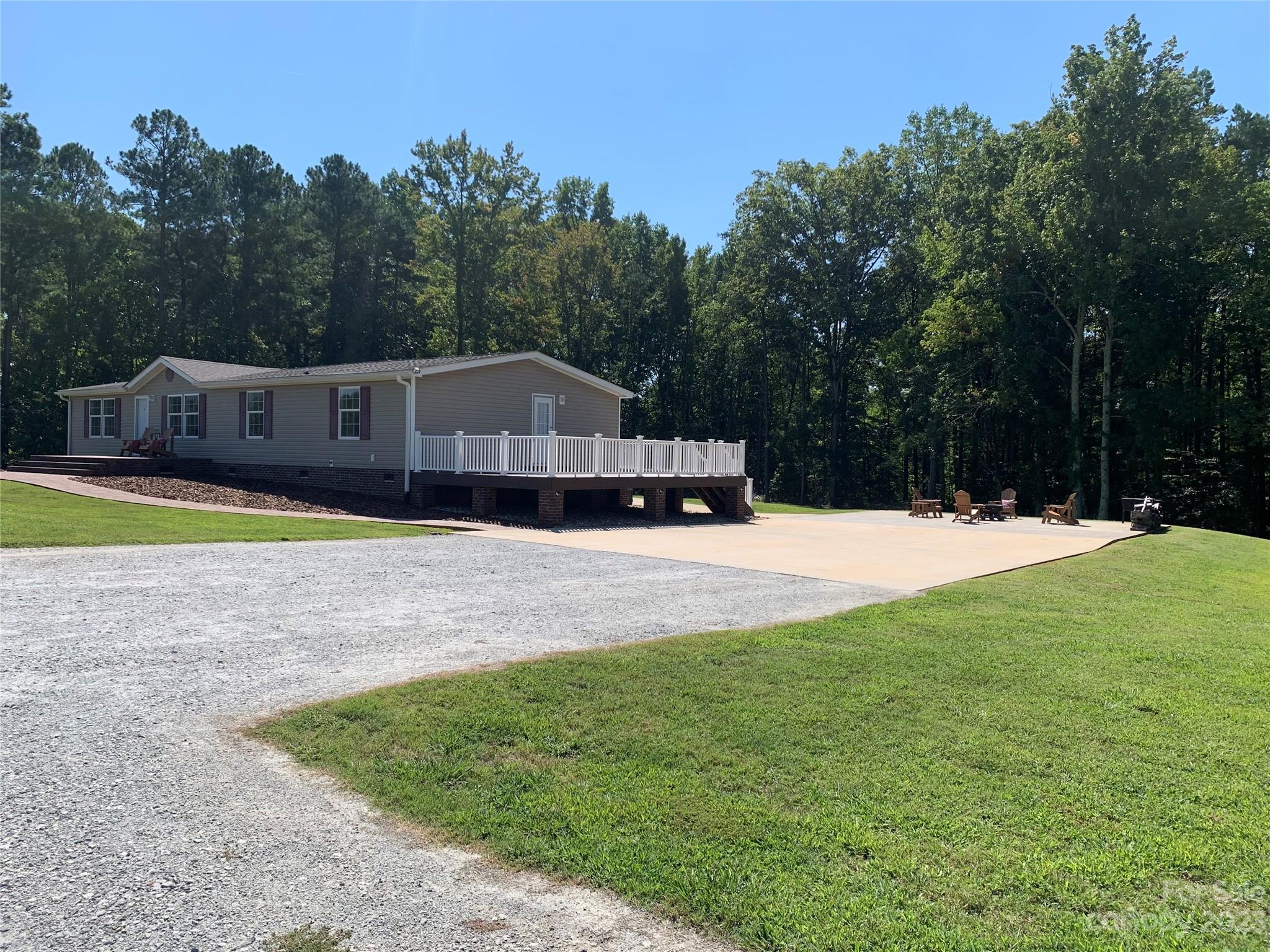 2380 Briggs Road Salisbury, NC 28147 - Photo 1 of 27 a view of swimming pool with a yard and trees