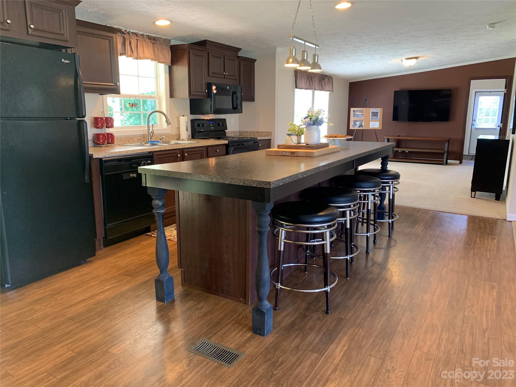 2380 Briggs Road Salisbury, NC 28147 - Photo 2 of 27 a kitchen with a sink appliances and cabinets