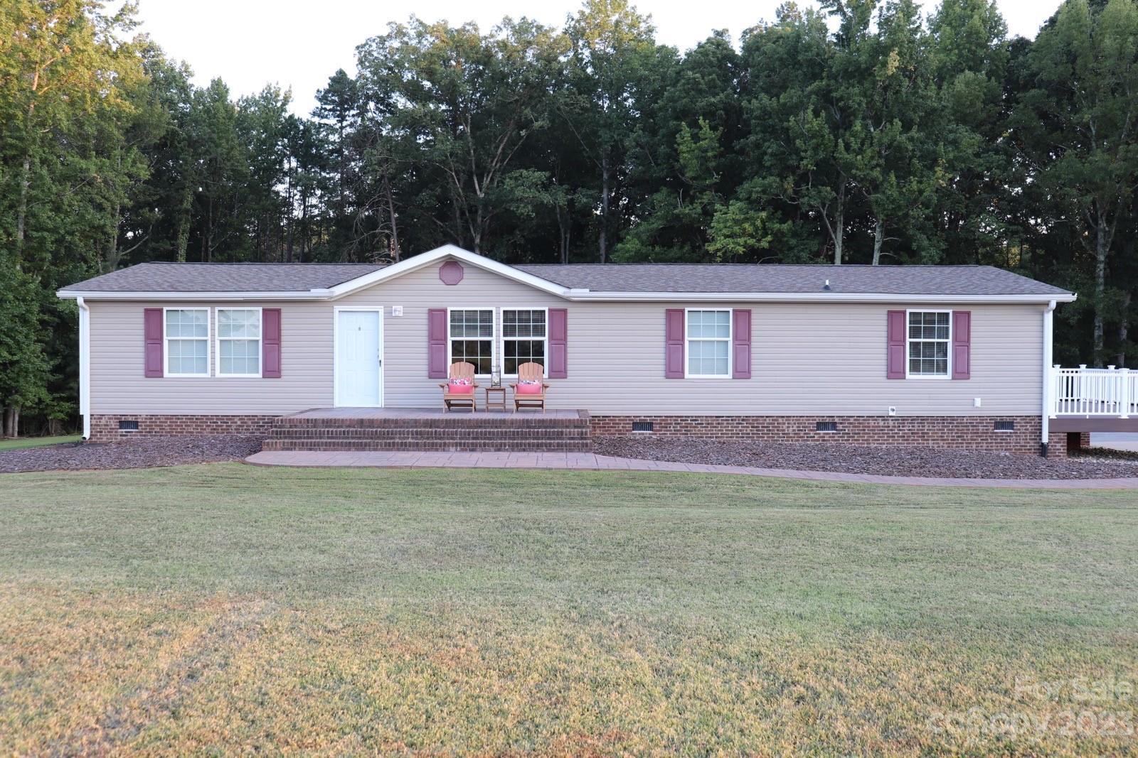 2380 Briggs Road Salisbury, NC 28147 - Photo 25 of 27 a front view of a house with a garden