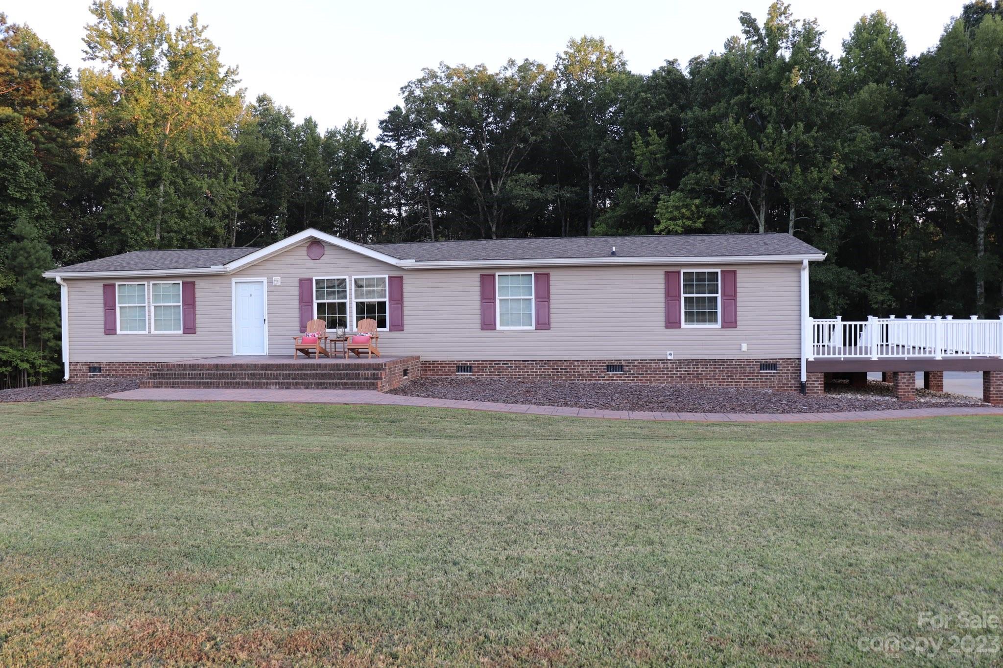 2380 Briggs Road Salisbury, NC 28147 - Photo 26 of 27 a front view of a house with garden