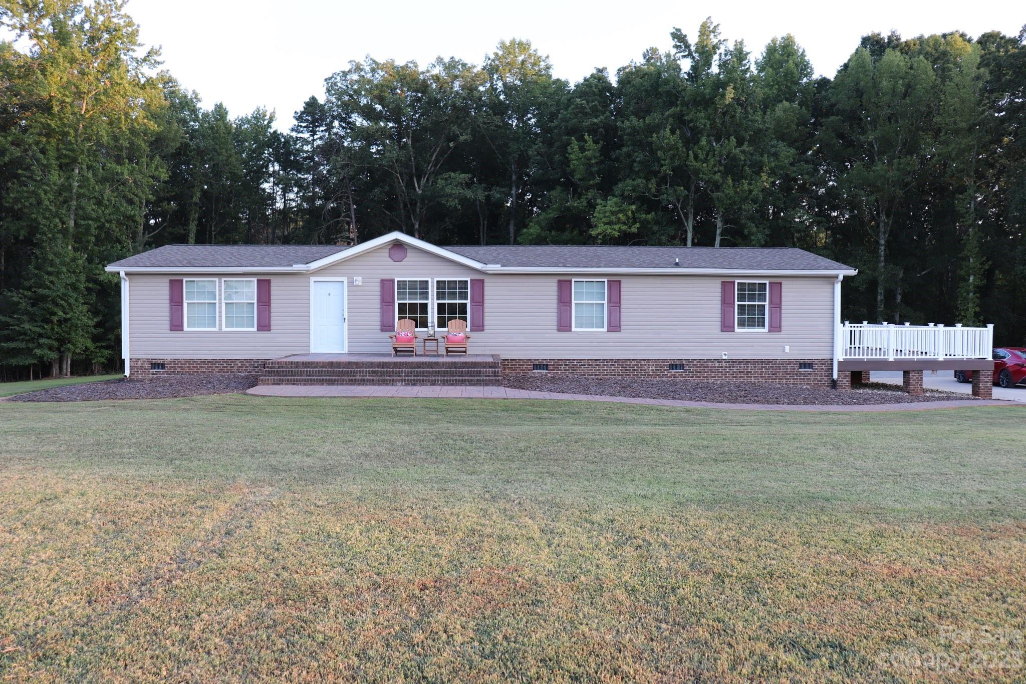 2380 Briggs Road Salisbury, NC 28147 - Photo 27 of 27 a front view of a house with garden