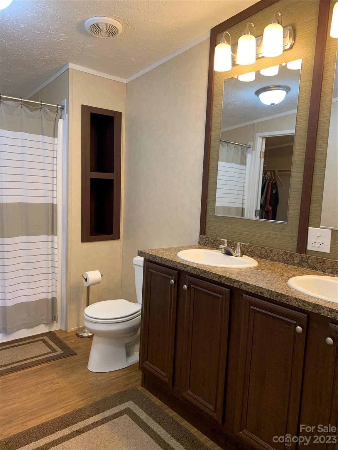 2380 Briggs Road Salisbury, NC 28147 - Photo 10 of 27 a bathroom with a sink and a mirror