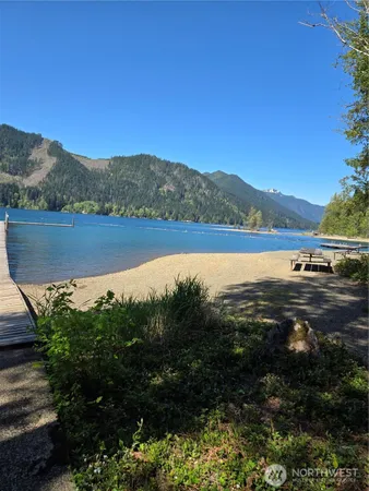 a view of a lake with houses in the back