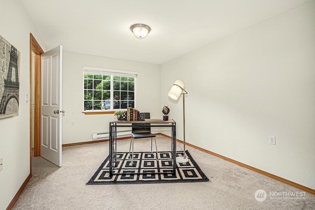 1009 112th Street Southeast, Unit E104 Everett, WA 98208 - Photo 14 of 24 a view of room with window and lounge chair