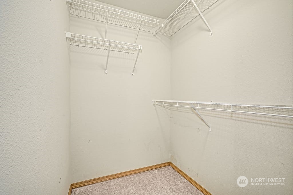 1009 112th Street Southeast, Unit E104 Everett, WA 98208 - Photo 15 of 24 a view of a room with racks on the wall
