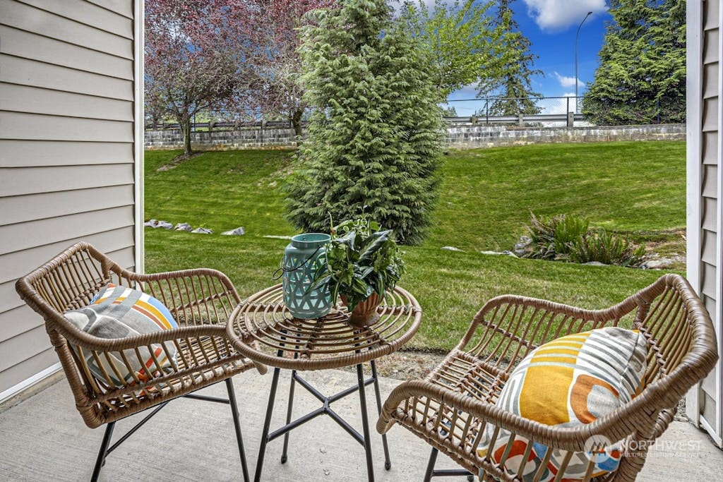 1009 112th Street Southeast, Unit E104 Everett, WA 98208 - Photo 17 of 24 a view of a chairs and table in patio