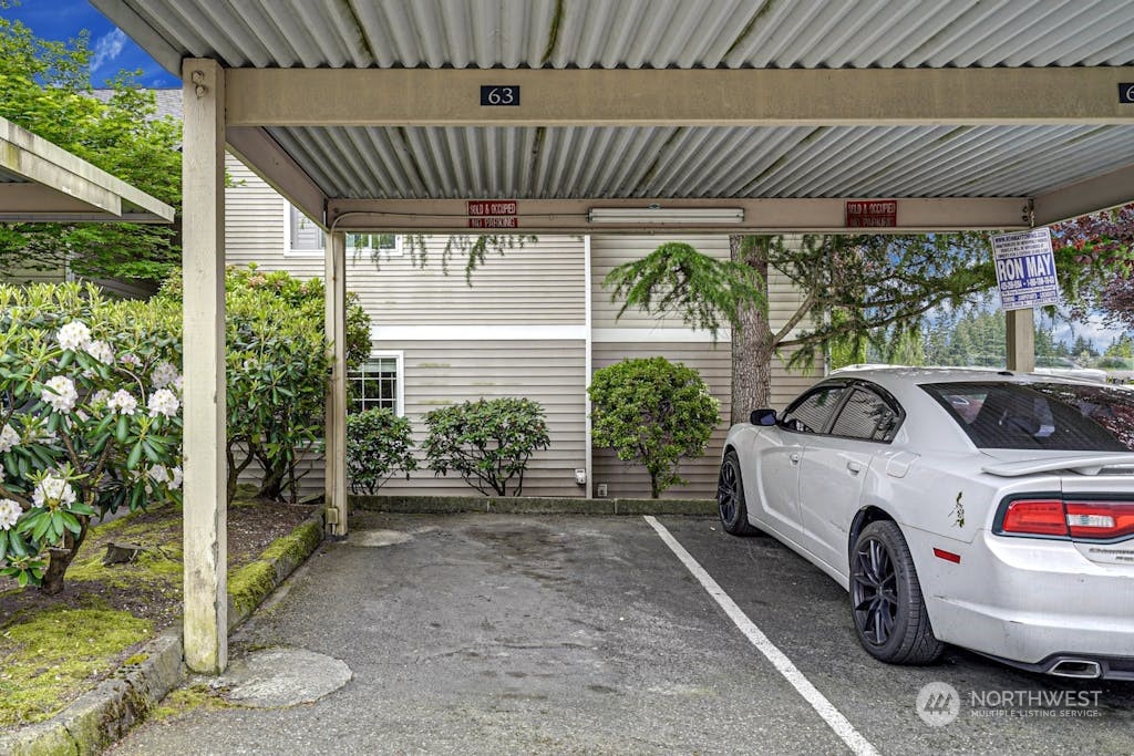 1009 112th Street Southeast, Unit E104 Everett, WA 98208 - Photo 20 of 24 a car parked in front of a house