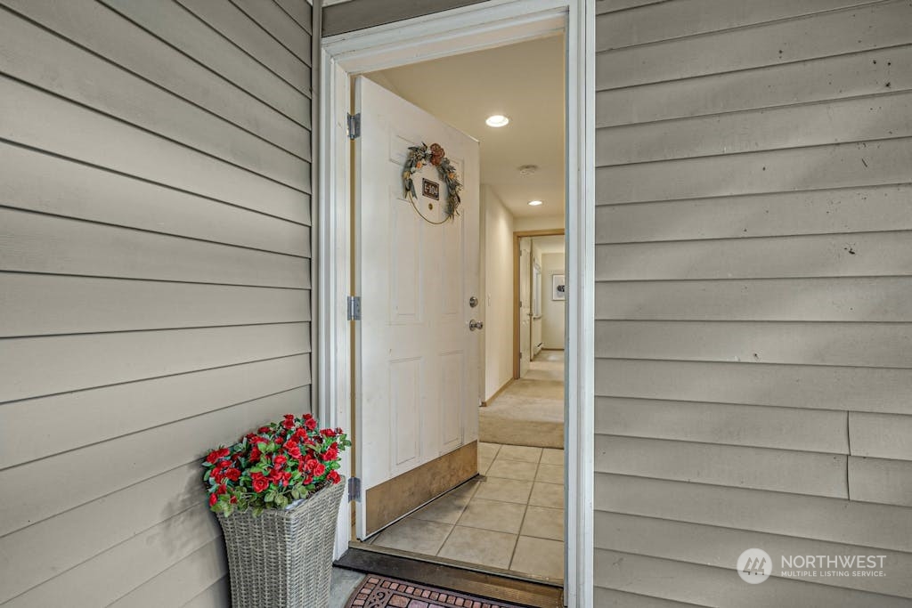 1009 112th Street Southeast, Unit E104 Everett, WA 98208 - Photo 21 of 24 a house view with a potted plant