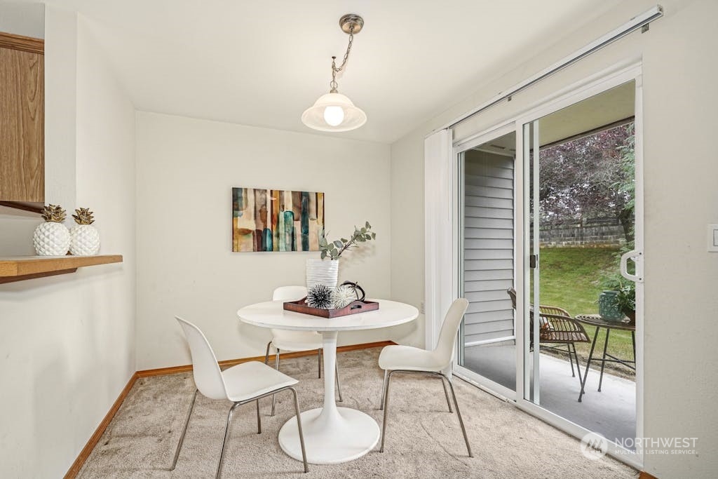 1009 112th Street Southeast, Unit E104 Everett, WA 98208 - Photo 10 of 24 a dining room with furniture and window