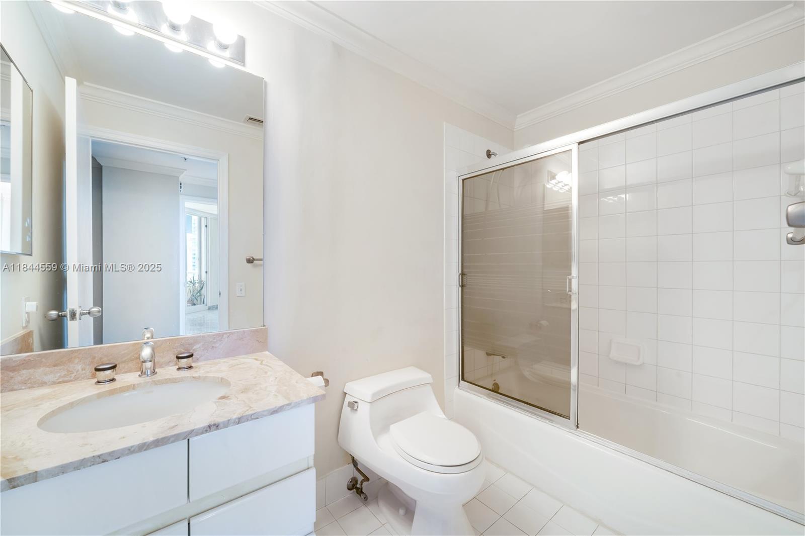 888 Brickell Key Drive, Unit 1912 Miami, FL 33131 - Photo 29 of 37 a bathroom with a sink toilet and shower