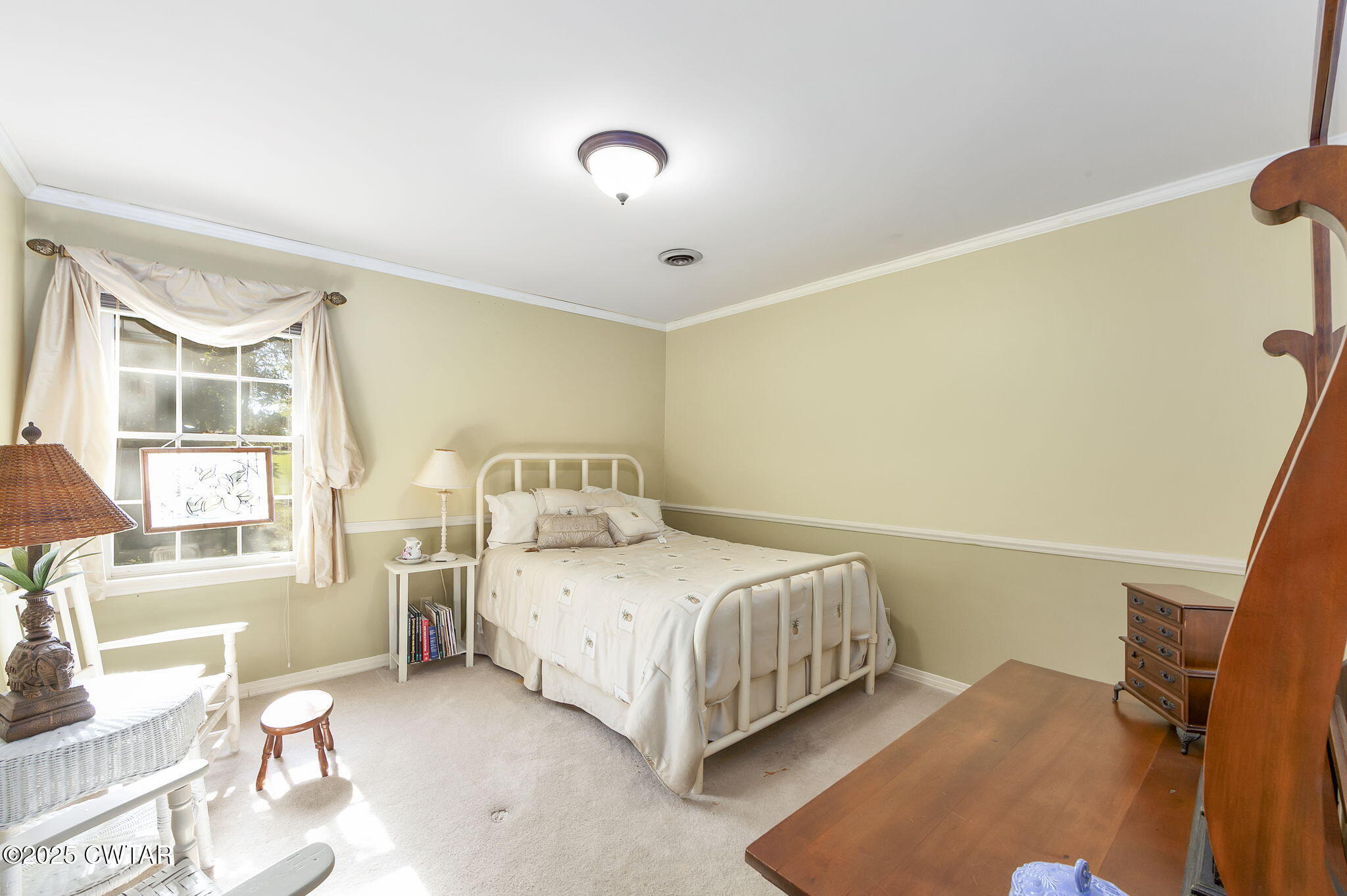 189 Valley Oak Loop Jackson, TN 38305 - Photo 11 of 22 a bedroom with a bed and wooden floor