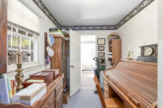 a bedroom with furniture and a window