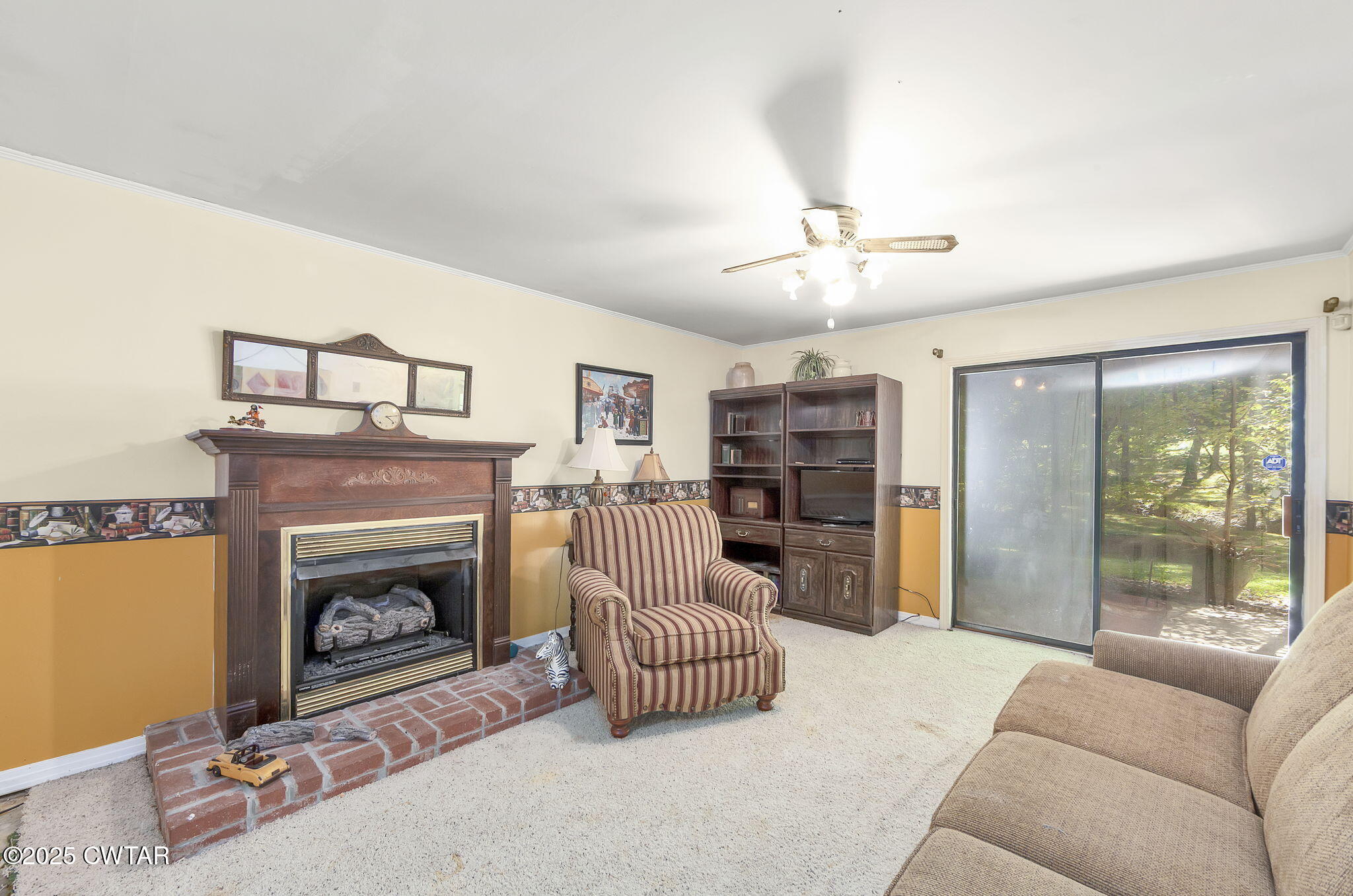 189 Valley Oak Loop Jackson, TN 38305 - Photo 19 of 22 a living room with furniture and a fireplace