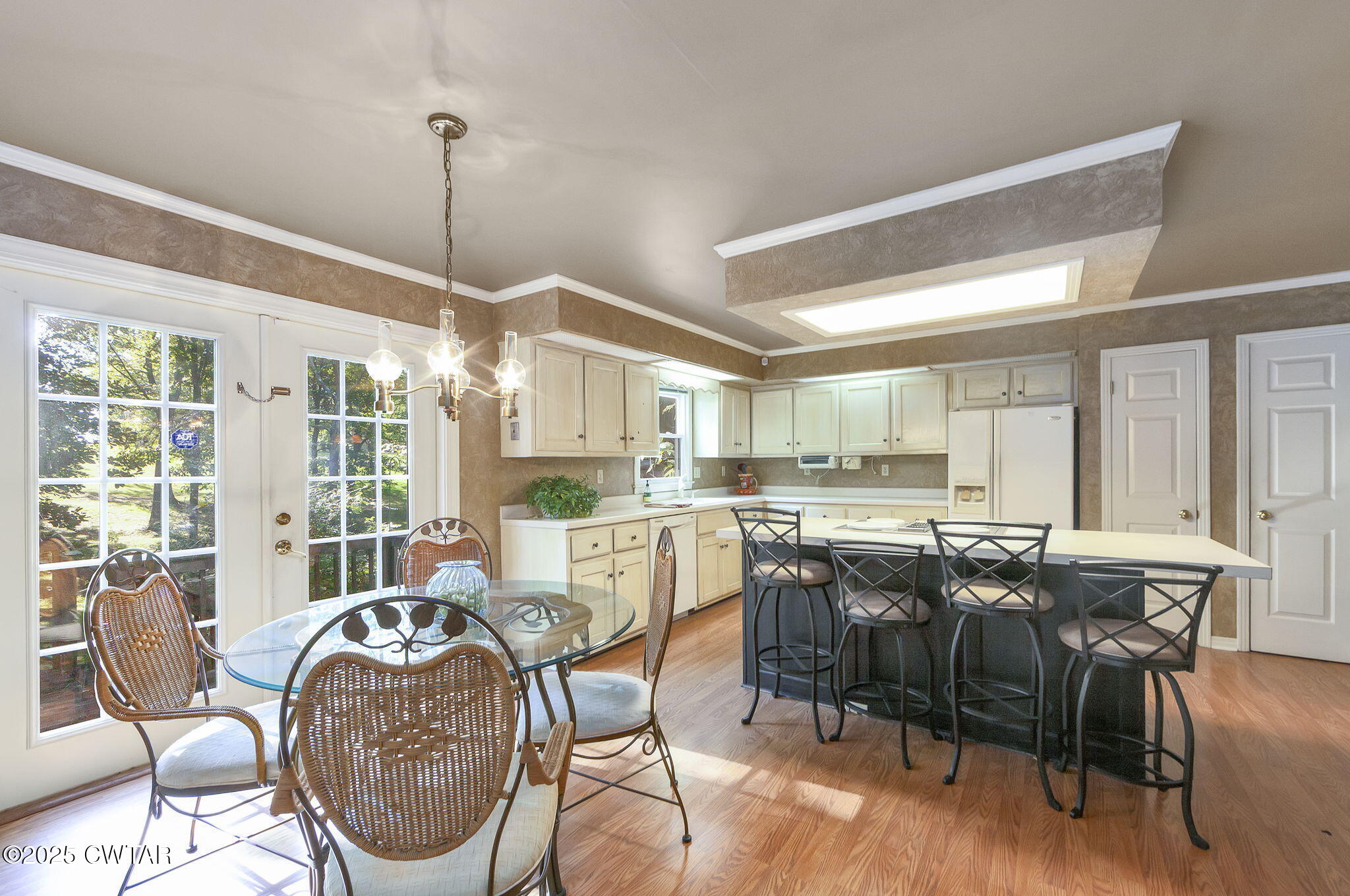 189 Valley Oak Loop Jackson, TN 38305 - Photo 4 of 22 a dining room with furniture a chandelier and wooden floor