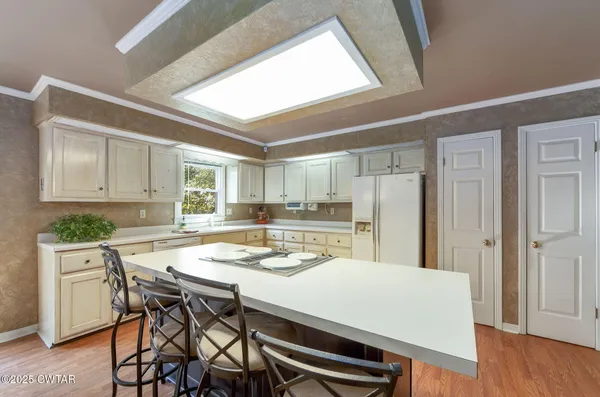 a kitchen with a table and chairs