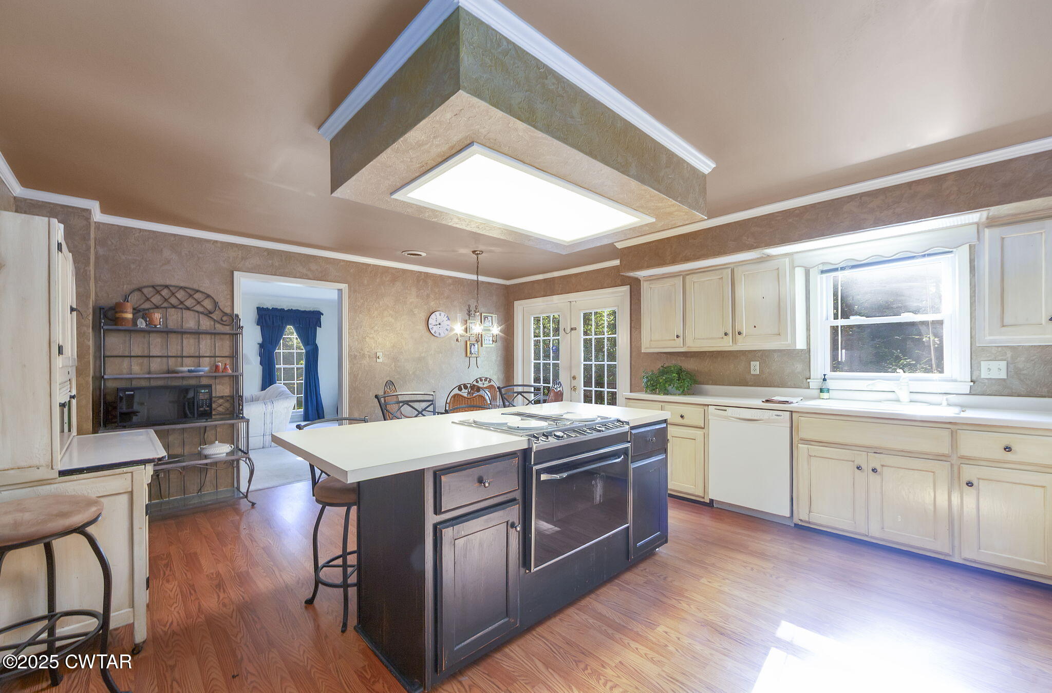 189 Valley Oak Loop Jackson, TN 38305 - Photo 6 of 22 a large kitchen with kitchen island a sink stainless steel appliances and cabinets