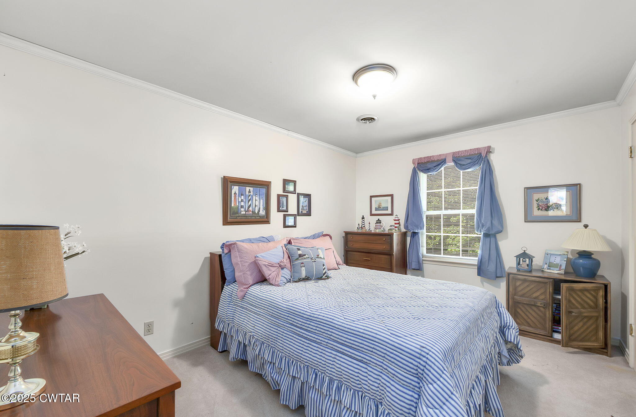 189 Valley Oak Loop Jackson, TN 38305 - Photo 10 of 22 a bedroom with a large bed and a window