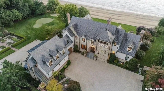 an aerial view of a house with outdoor space and street view