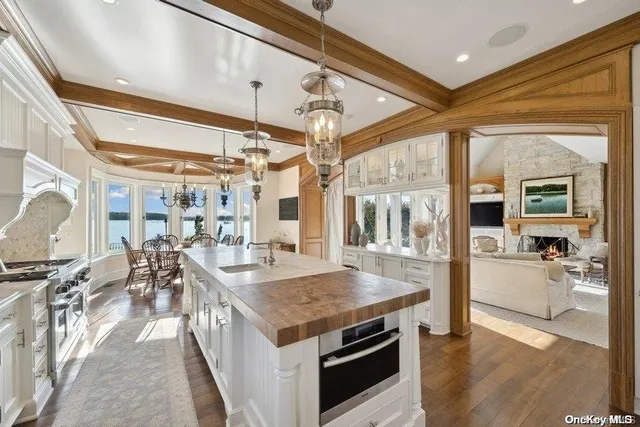 a open kitchen with stainless steel appliances granite countertop a stove and refrigerator
