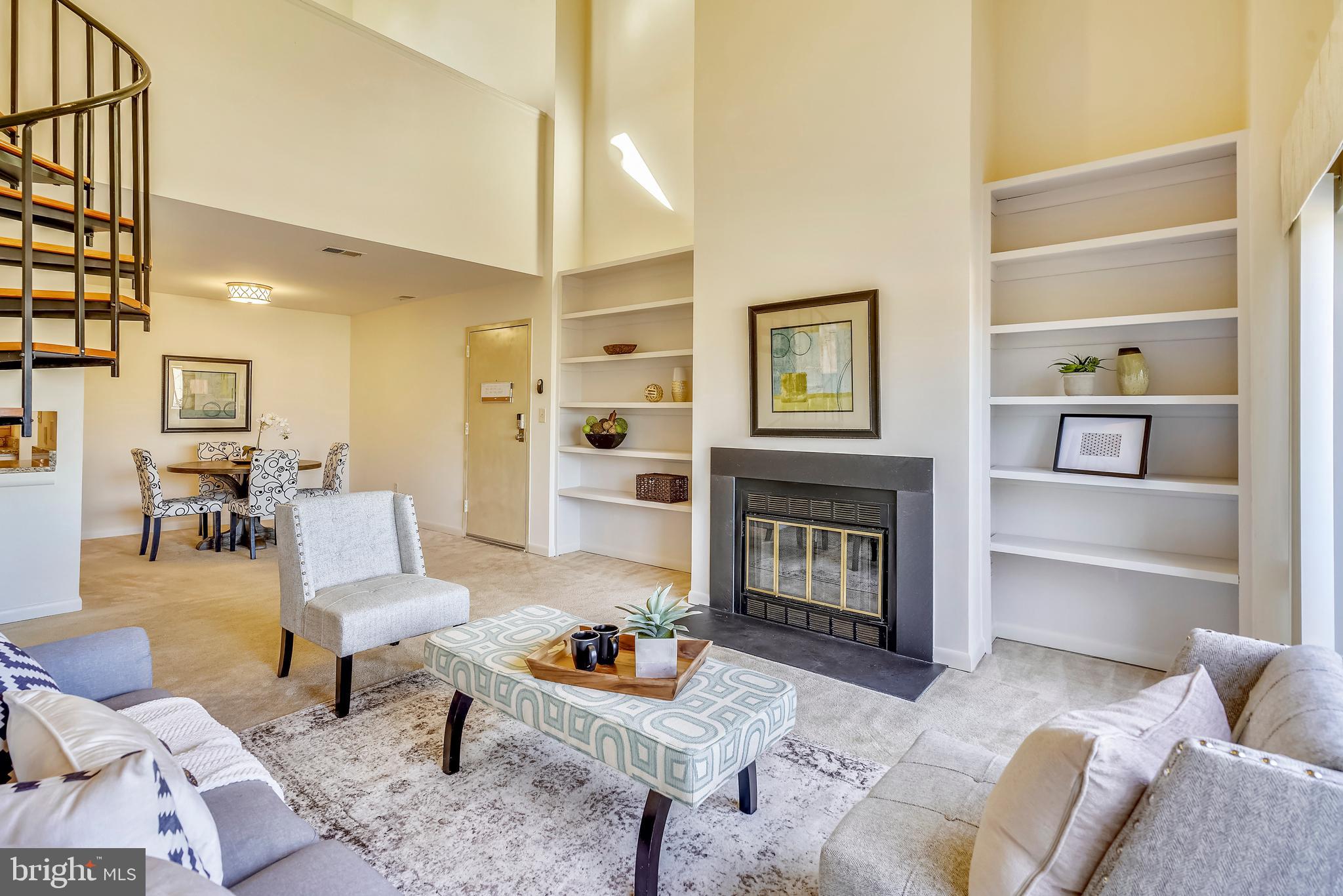 Wood burning fireplace and lots of shelves.