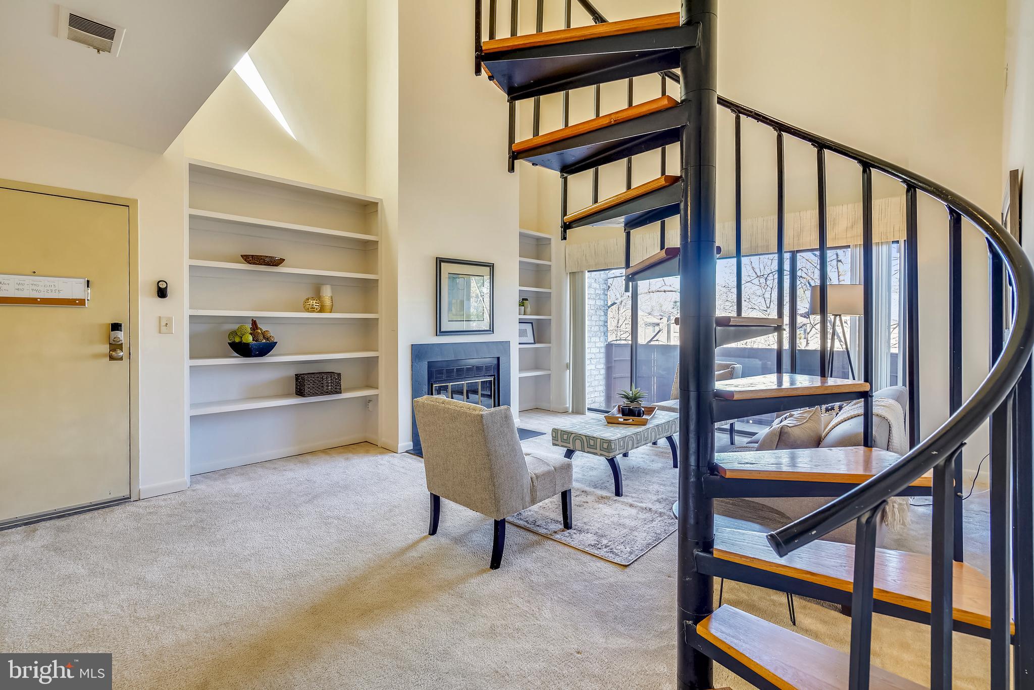 Spiral staircase leads to loft and walk-in attic.
