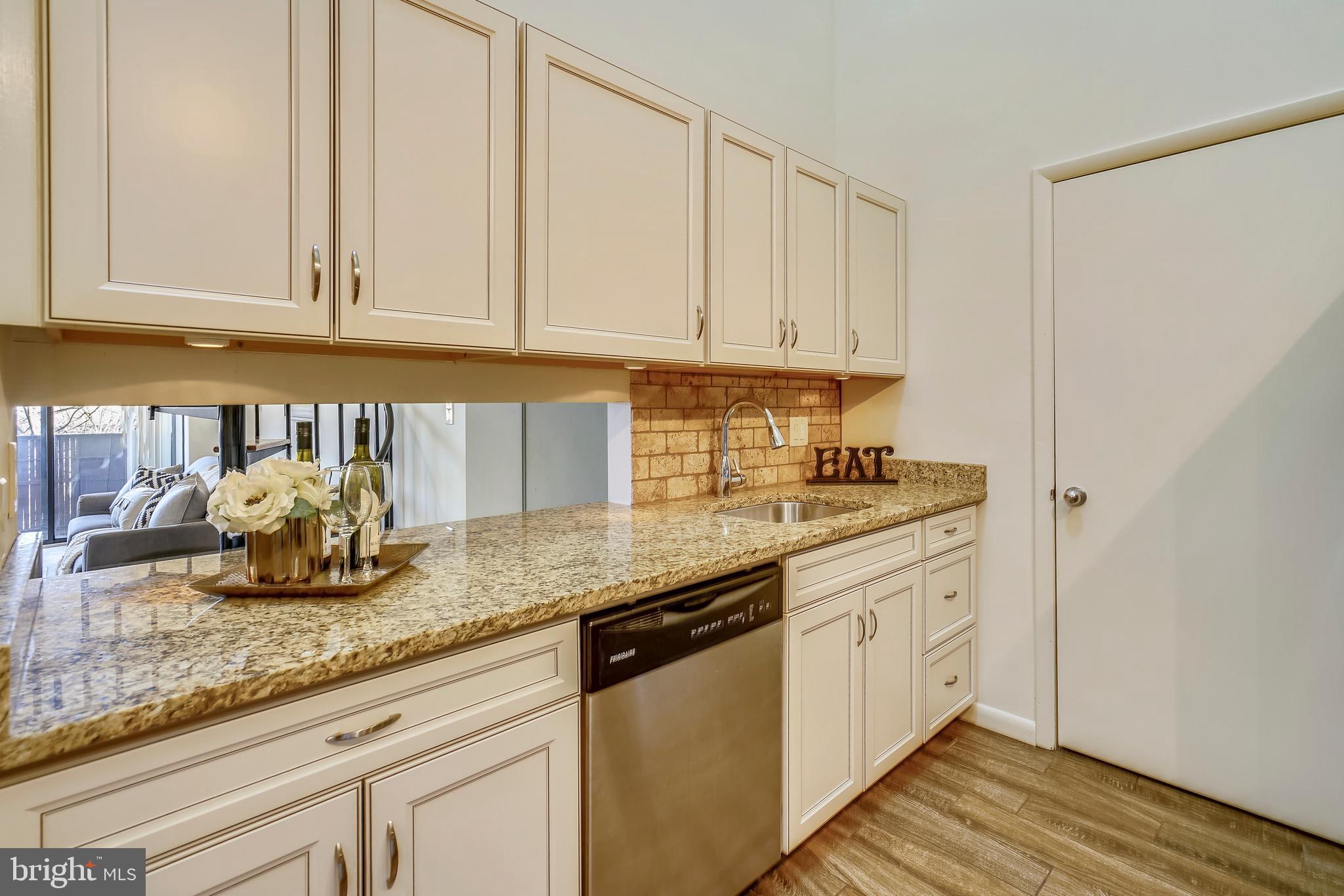 5590 Vantage Point Road, Unit 9 Columbia, MD 21044 - Photo 8 of 38 View from kitchen to stackable washer/dryer.
