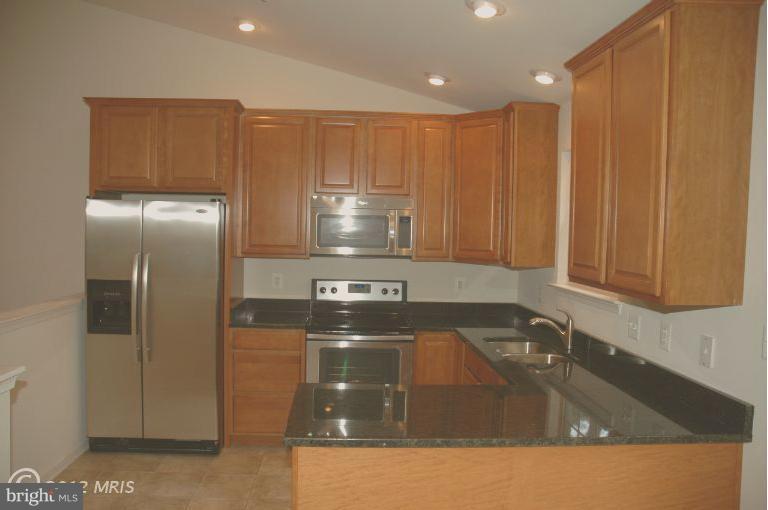 Kitchen has stainless appliances.