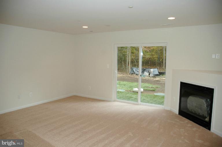 161 Ryan Road Pasadena, MD 21122 - Photo 16 of 16 Family Room has a gas fireplace.