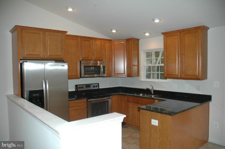 Kitchen has granite counter tops.