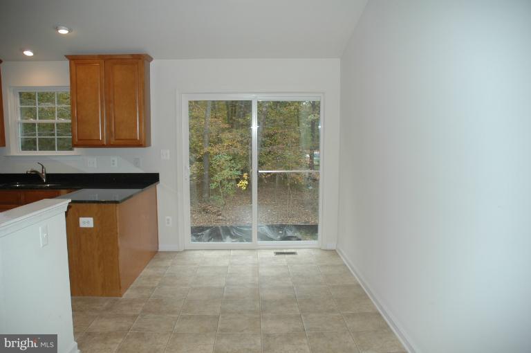 Spacious Breakfast Area overlooks back yard.