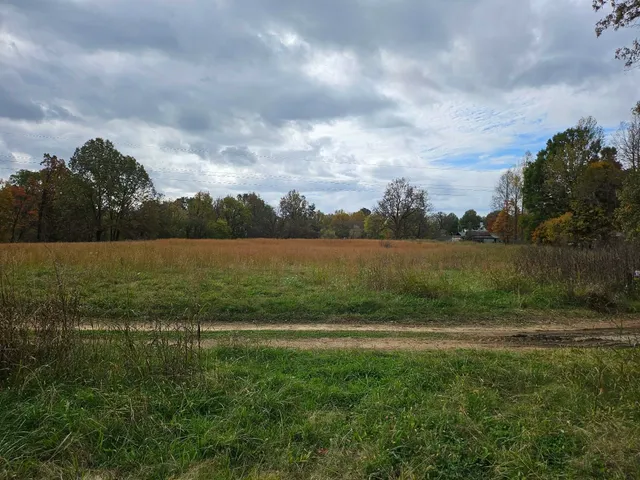 a view of a lake with a yard