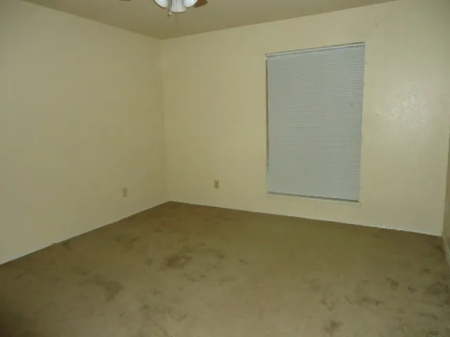 an empty room with a bench