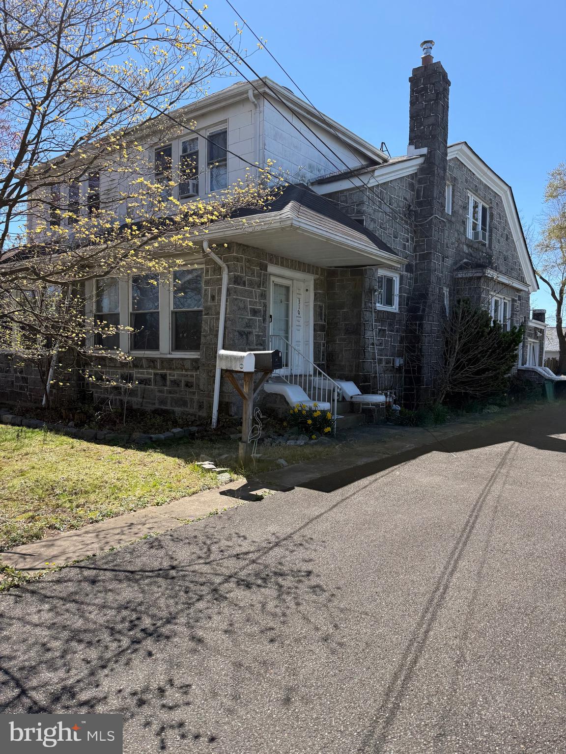 310 Wynnewood Avenue Croydon, PA 19021 - Photo 2 of 22 a front view of a house with a yard