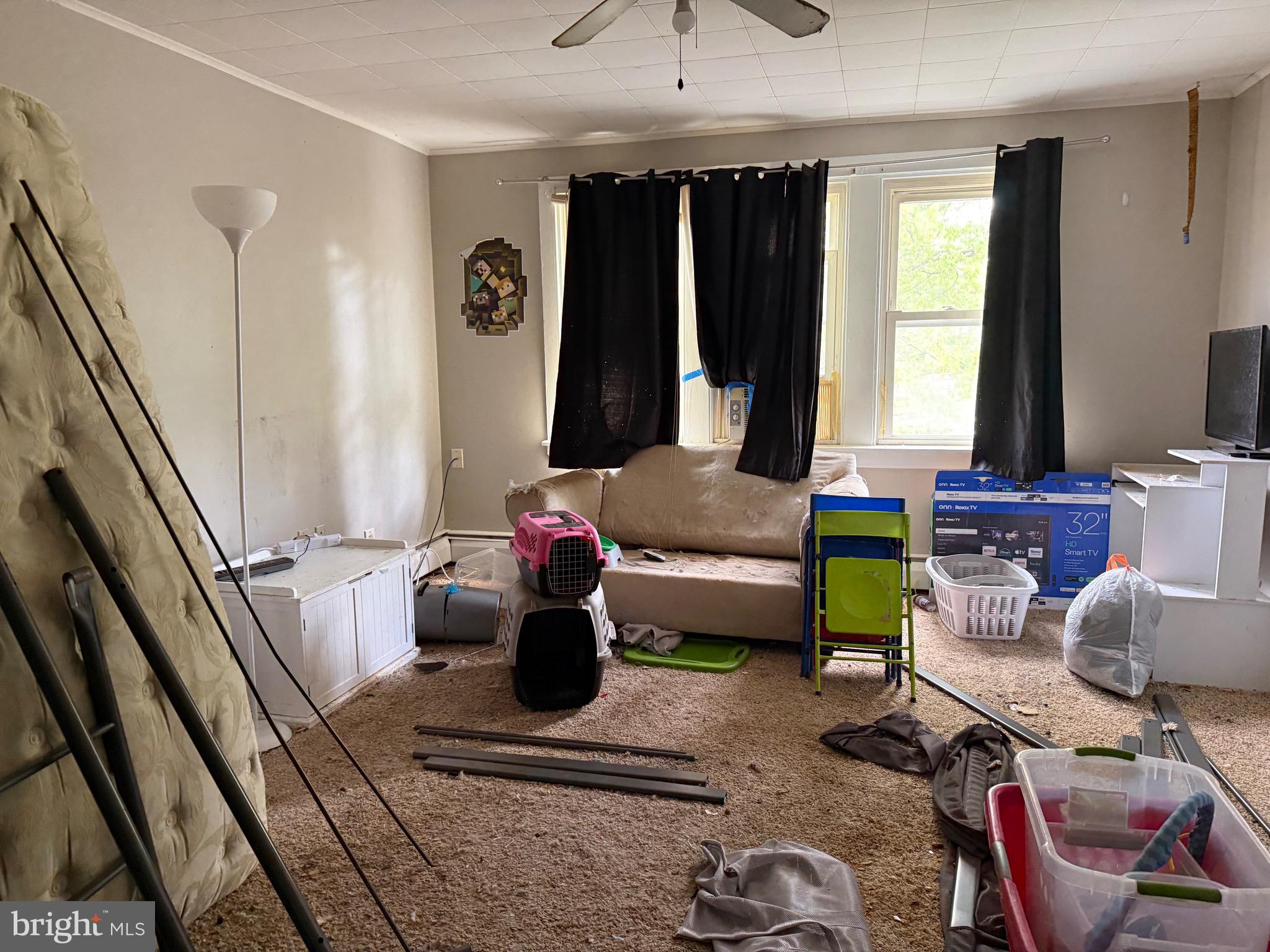 310 Wynnewood Avenue Croydon, PA 19021 - Photo 5 of 22 a living room with furniture and a window