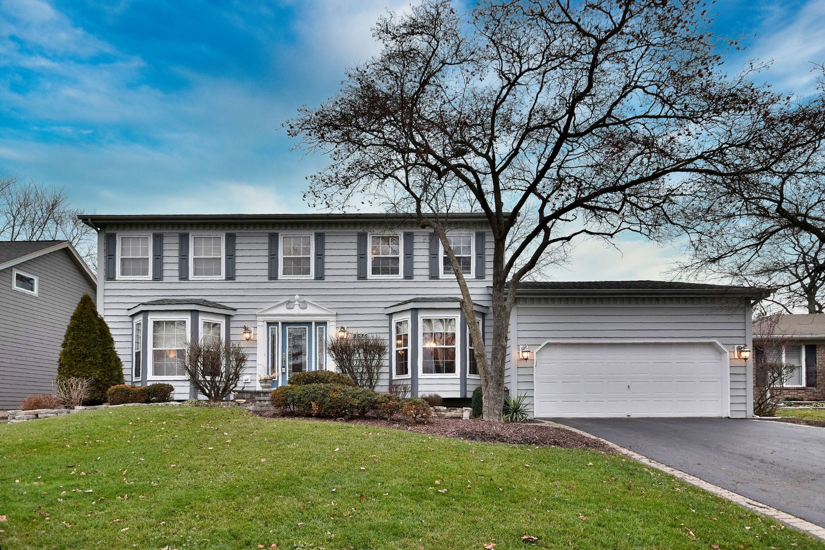 2535 Sun Valley Road Lisle, IL 60532 - Photo 1 of 54 front view of a house with a yard