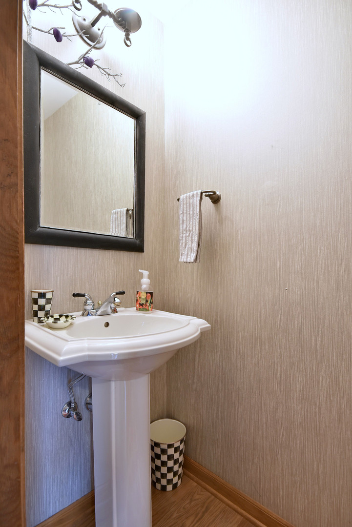 2535 Sun Valley Road Lisle, IL 60532 - Photo 12 of 54 a bathroom with a sink a mirror and vanity